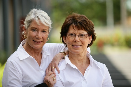 two older women standing outside