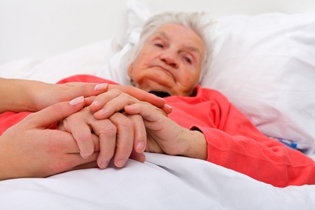 elderly woman with her caregiver at home