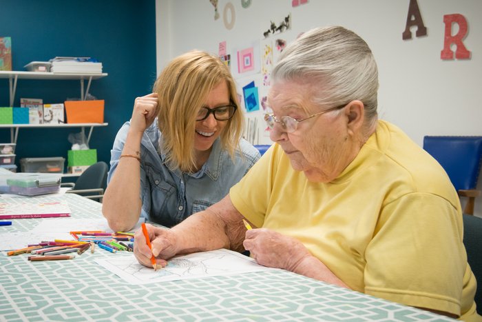 Two women engage in a drawing project