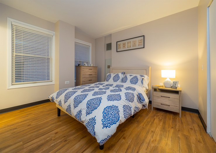 An apartment bedroom inside an assisted living community building