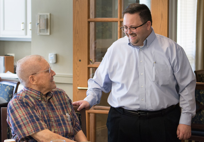 Two men appear to be delightfully engaged in conversation