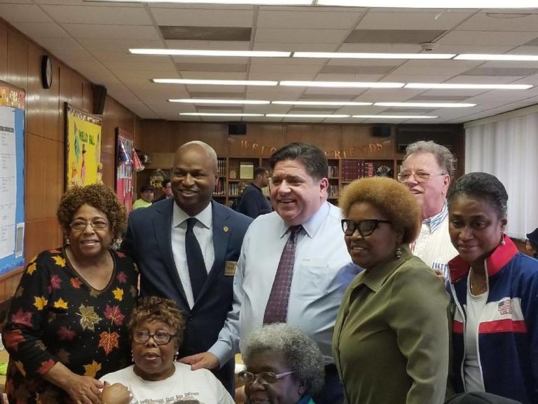 Image of a smiling group of seniors at West Suburban Senior Services.