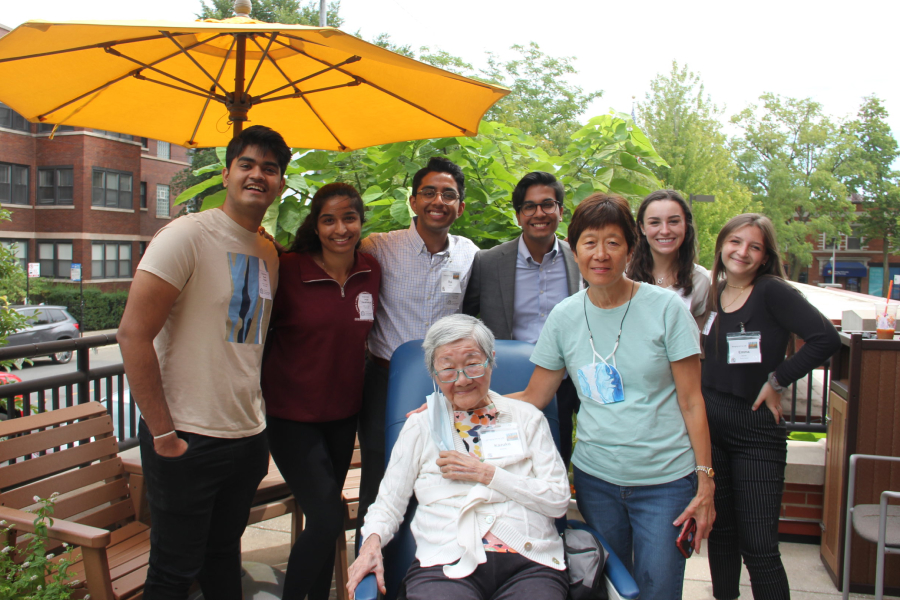 Image of young adults with two senior women.