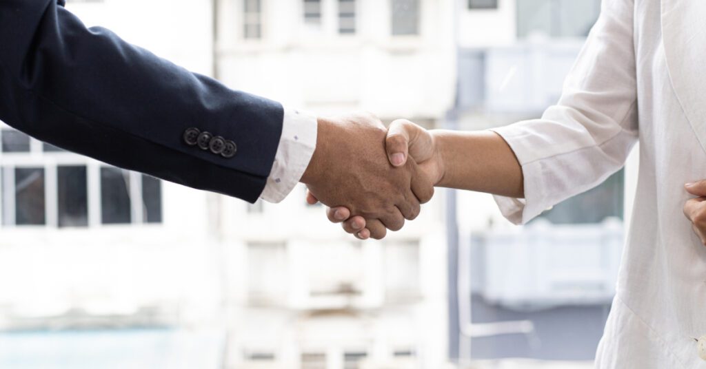 Two people shaking hands.